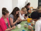 One of the activities on our outing - painting porcelain mugs. Concentrating hard, we are.